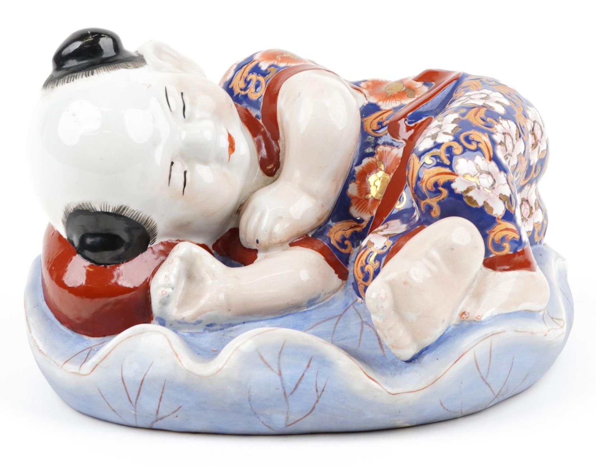 Chinese porcelain figure of a sleeping boy hand painted in the Imari palette, 24cm wide - Image 2 of 9