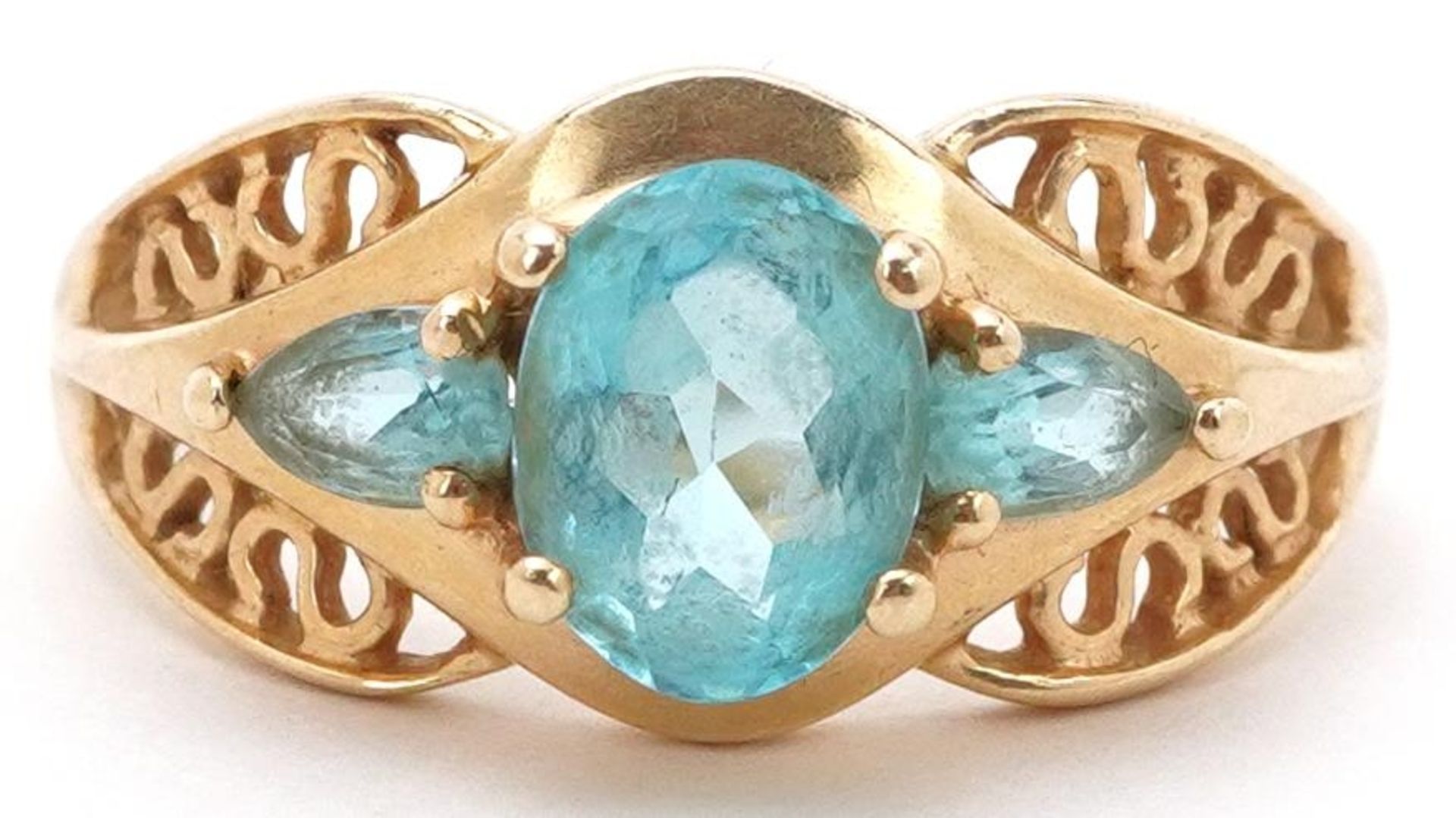 Chinese 14K gold blue topaz three stone ring with pierced shoulders, the central topaz approximately