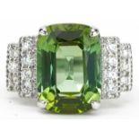 18ct white gold green cushion cut tourmaline ring with diamond set stepped shoulders with