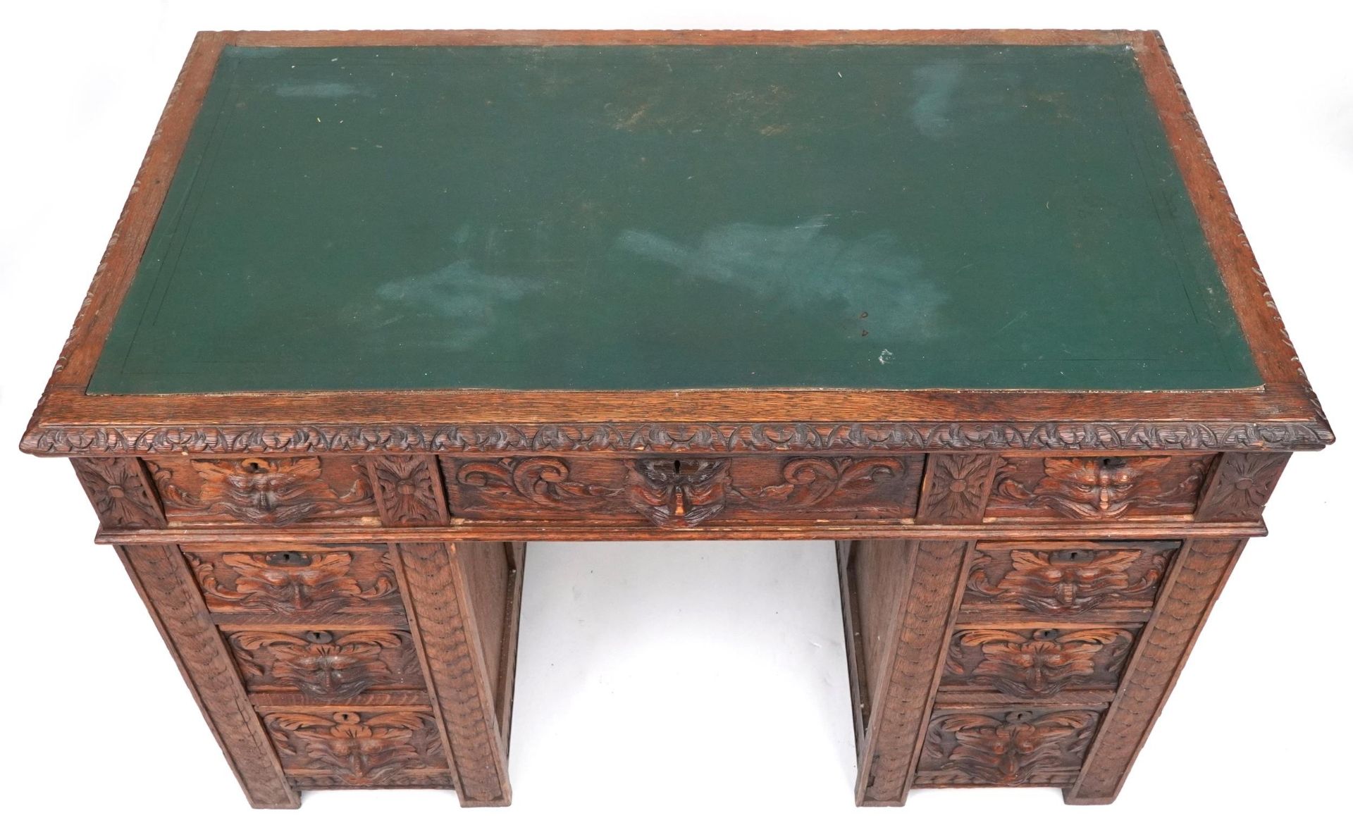 Victorian oak twin pedestal desk carved with a green man masks, fitted with an arrangement of nine - Image 3 of 5