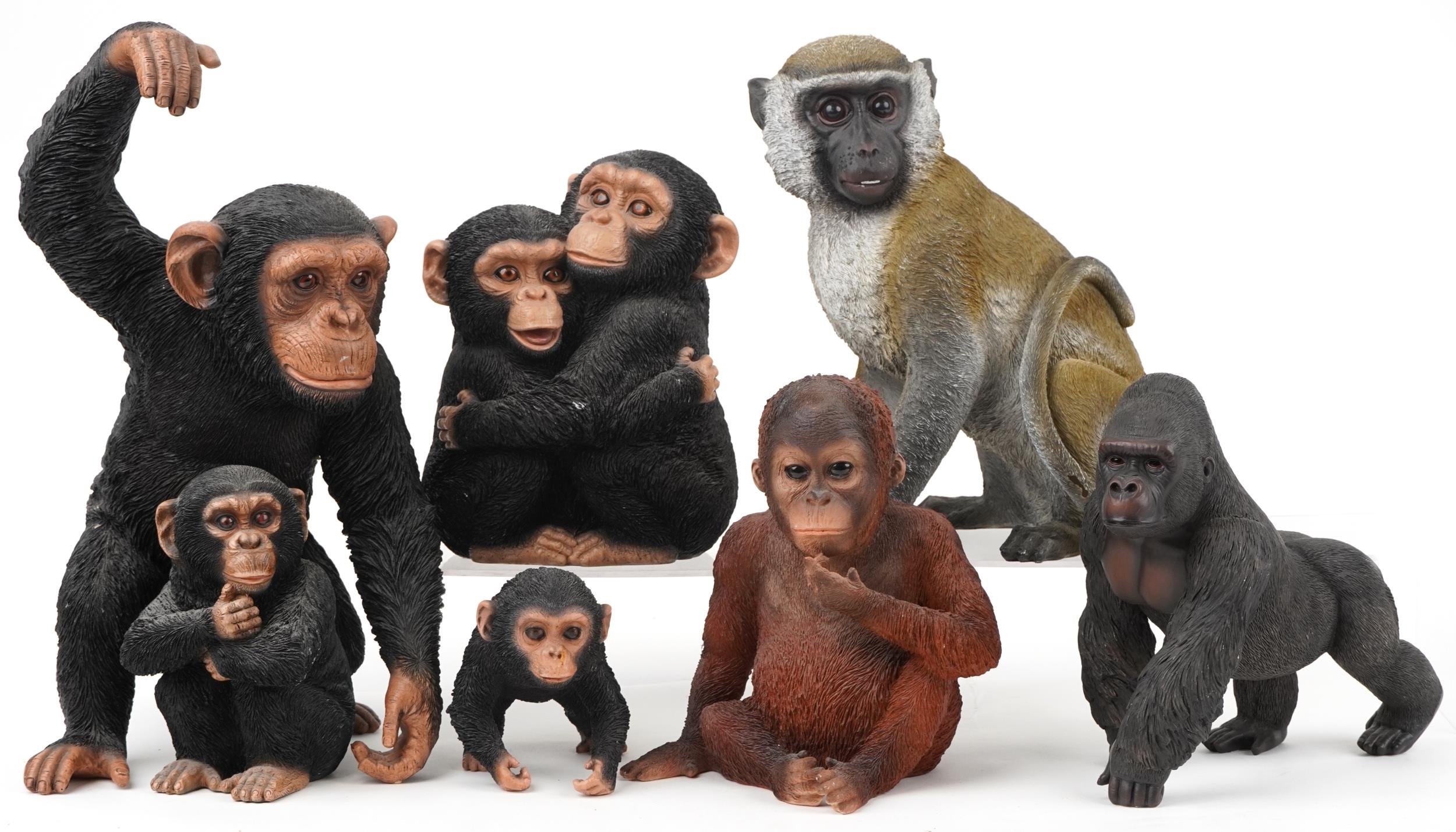 Six large hand painted model monkeys and a group of two chimpanzees, the largest 42cm high