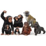 Six large hand painted model monkeys and a group of two chimpanzees, the largest 42cm high