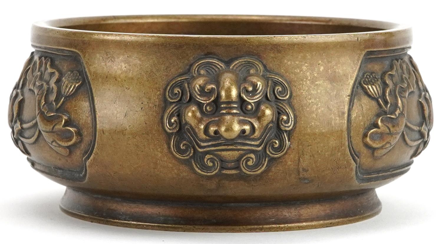 Chinese patinated bronze censer with animalia handles cast in relief with panels of flowers, four - Image 4 of 7