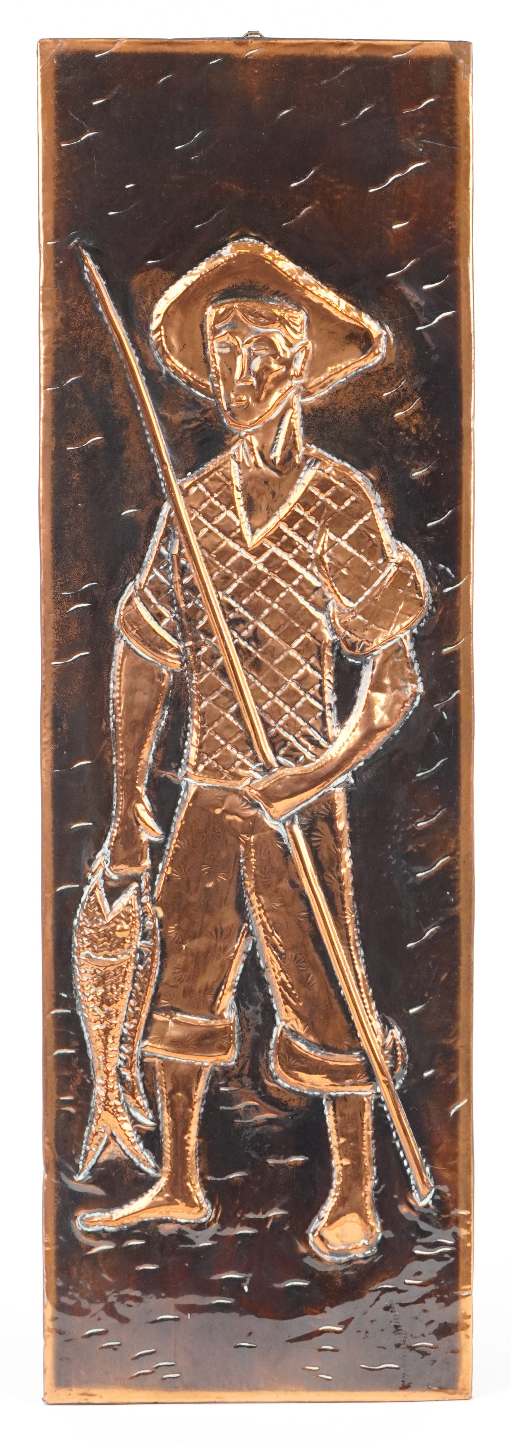 Arts & Crafts style copper wall plaque embossed with a young fisherman, 58.5cm x 19cm