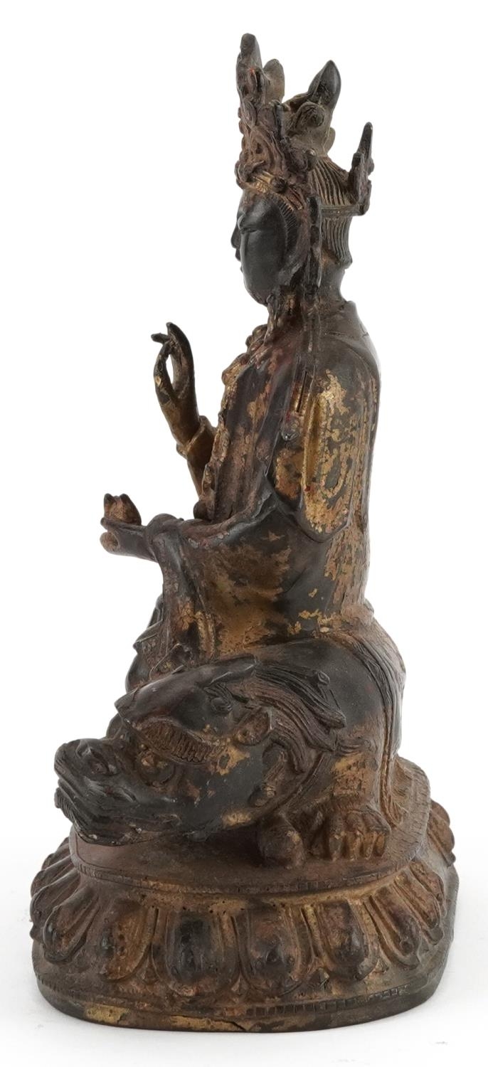 Chino Tibetan gilt bronze figure of Buddha on mythical animal, 22.5cm high - Image 3 of 7