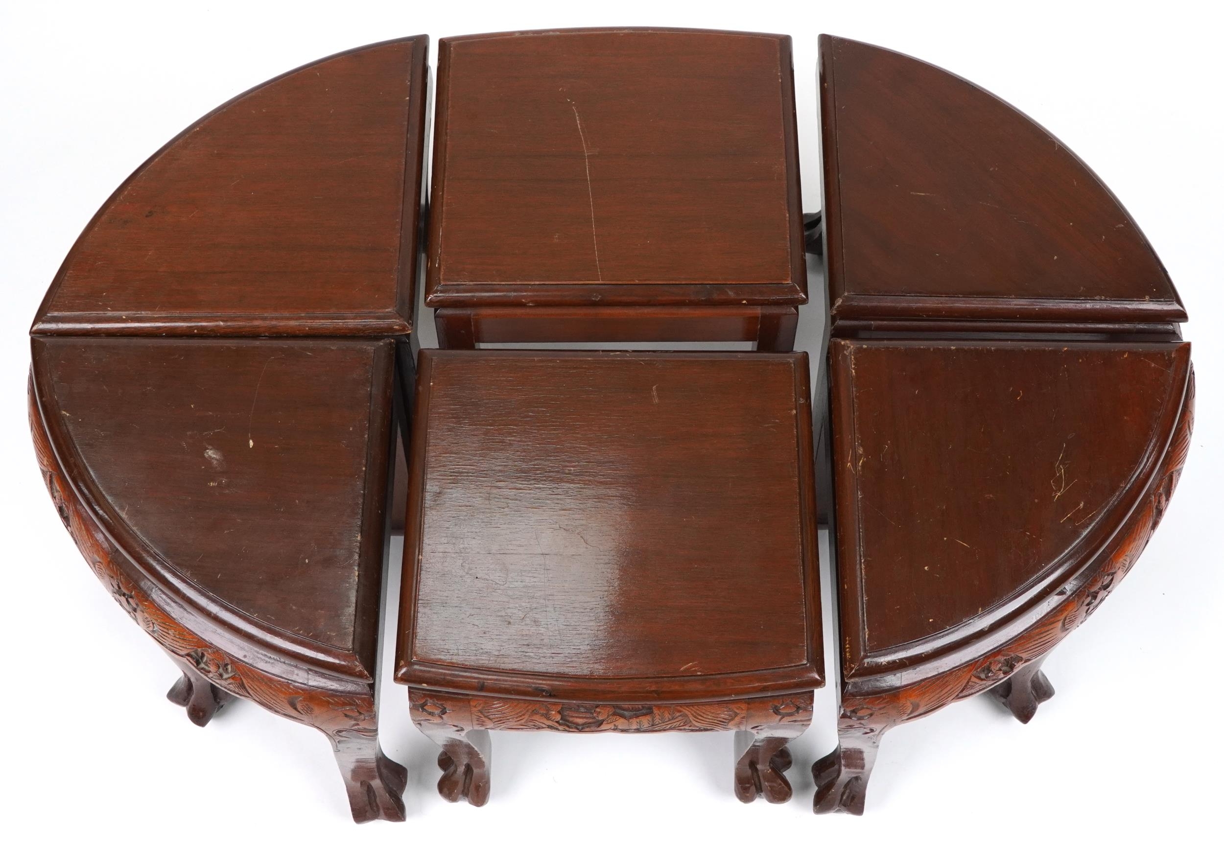 Nest of seven Chinese camphor wood occasional tables comprising an oval coffee table housing six - Image 8 of 9