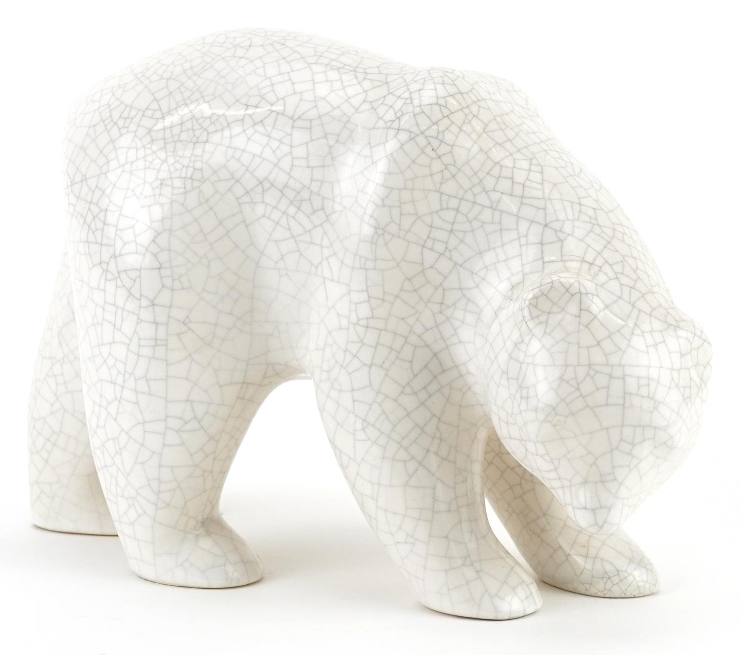 French Art Deco pottery polar bear having a white crackle glaze, 23cm in length