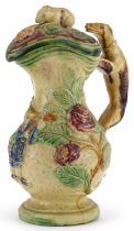 19th century Majolica lidded jug with handle in the form of a Greyhound, decorated in relief with