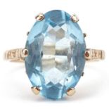 9ct gold blue stone ring with engraved shoulders, the blue stone approximately 16.0mm x 11.0mm x 6.