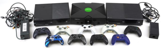 Three Xbox games consoles and nine Xbox controllers