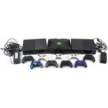 Three Xbox games consoles and nine Xbox controllers