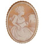 9ct gold mounted shell cameo pendant brooch carved with a young female reading a book, 5cm high, 5.