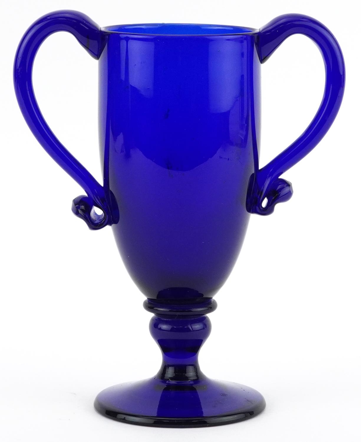 Antique Bristol Blue pedestal cup with twin handles, 16cm high