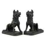 Pair of carved green hardstone sculptures of seated dogs, each 16cm high