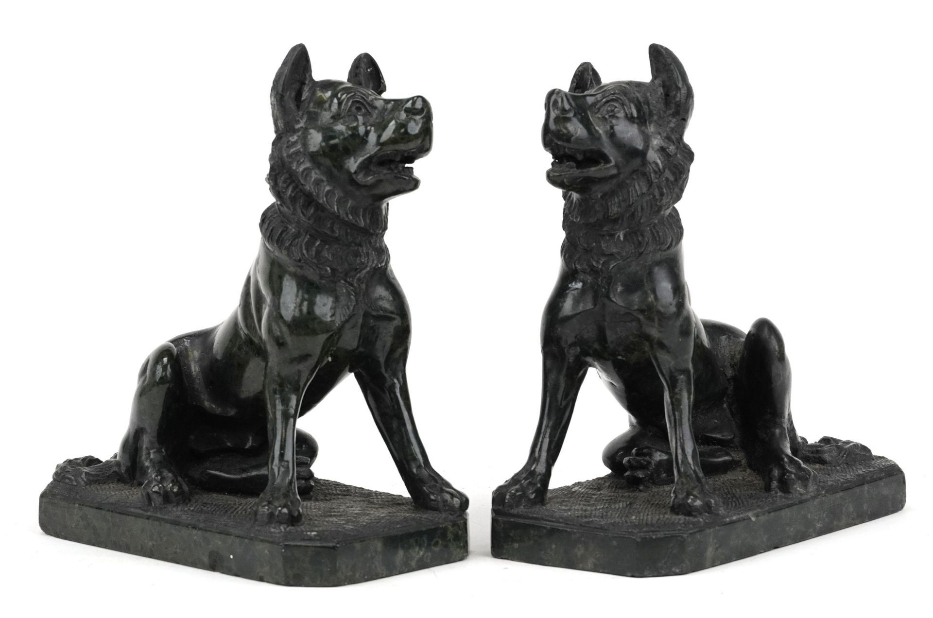 Pair of carved green hardstone sculptures of seated dogs, each 16cm high