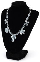 Good 18ct white gold teardrop aquamarine and diamond floral necklace, the largest aquamarine
