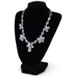 Good 18ct white gold teardrop aquamarine and diamond floral necklace, the largest aquamarine