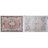 Two rectangular Chinese floral rugs, the largest 195cm x 122cm