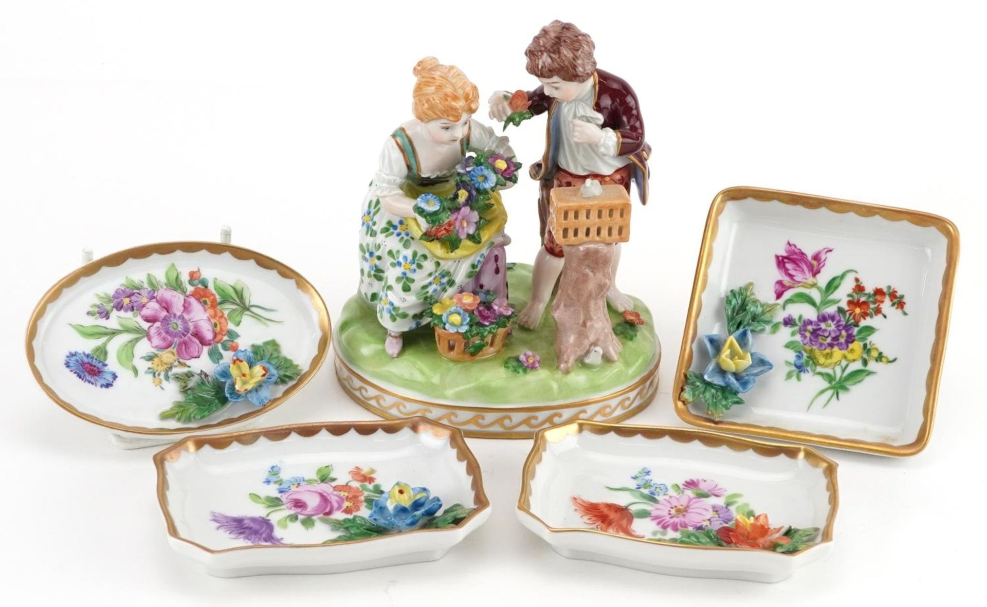 Dresden, German porcelain comprising a summer figure group of a young boy and girl holding flowers