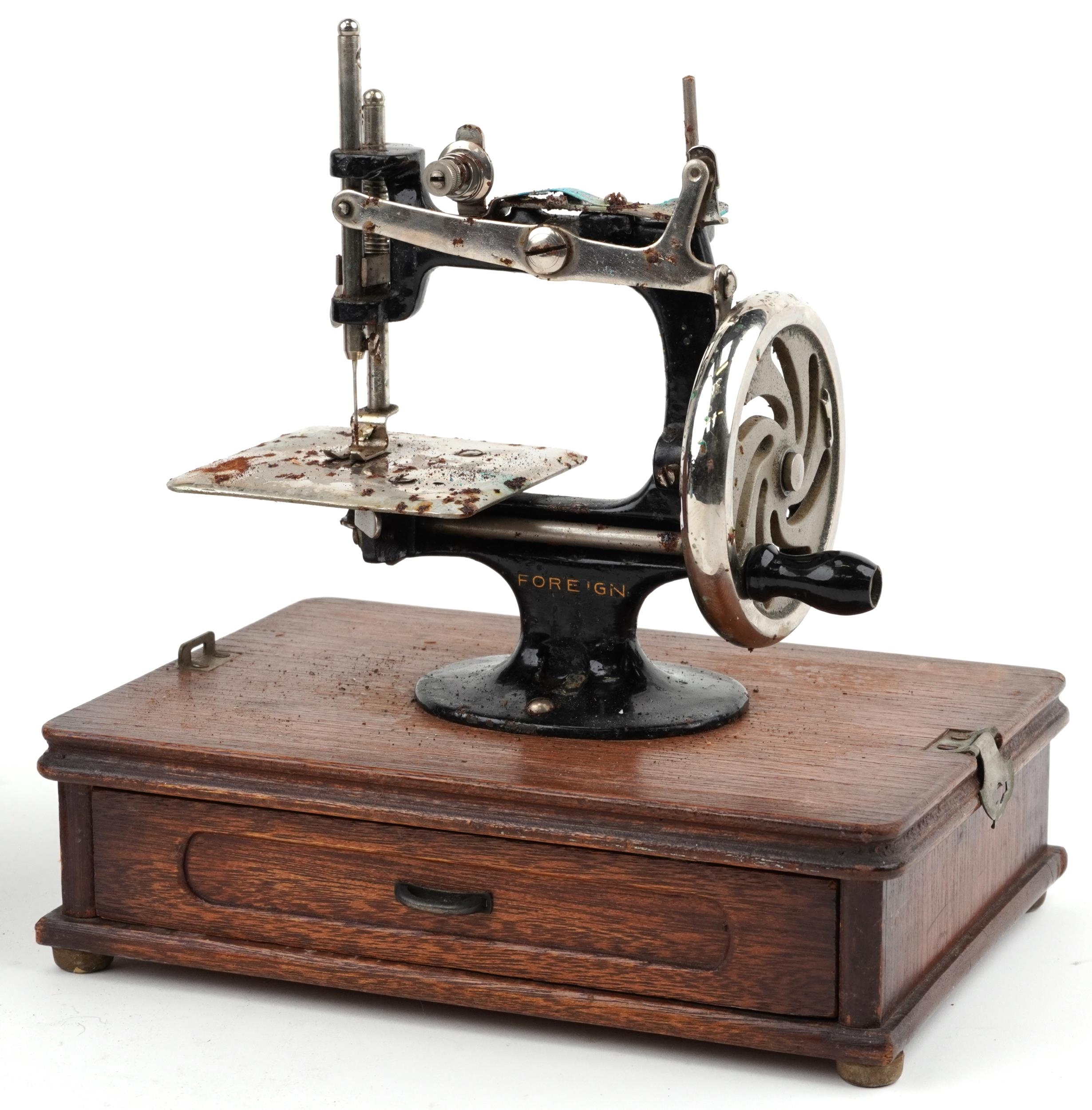Early 20th century continental cast iron child's sewing machine with dome top case - Image 2 of 4