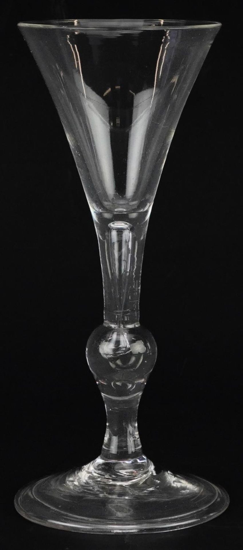 18th century wine glass on folded foot with knopped stem and enclosed bubble, 17cm high