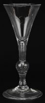 18th century wine glass on folded foot with knopped stem and enclosed bubble, 17cm high