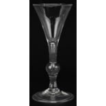 18th century wine glass on folded foot with knopped stem and enclosed bubble, 17cm high