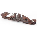 Chinese hardwood ruyi sceptre carved with two dragons chasing the flaming pearl, 43cm wide