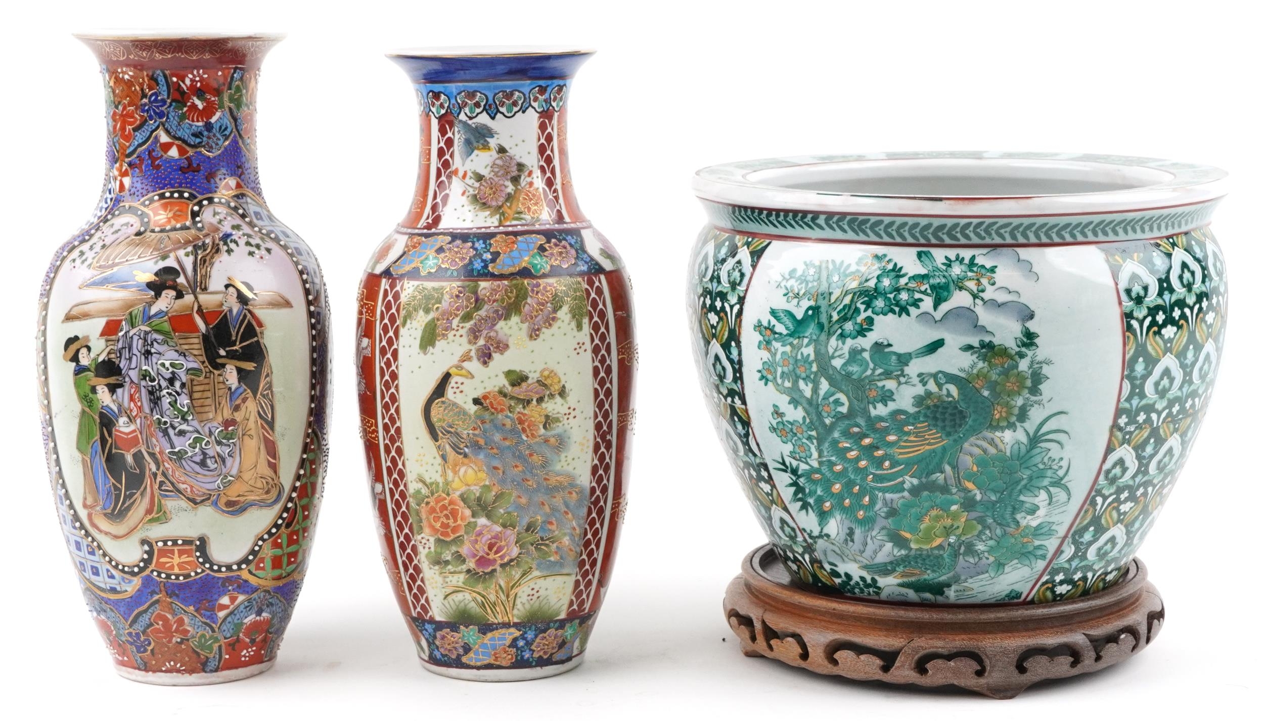 Chinese porcelain jardiniere decorated with birds of paradise and flowers and two vases, the