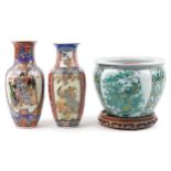 Chinese porcelain jardiniere decorated with birds of paradise and flowers and two vases, the