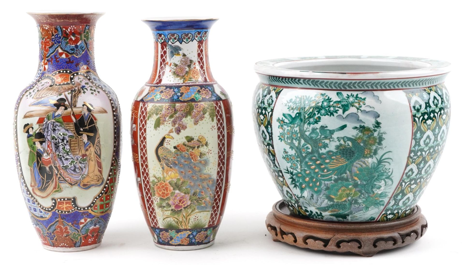 Chinese porcelain jardiniere decorated with birds of paradise and flowers and two vases, the