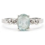 9ct white gold blue topaz ring with diamond set shoulders, the topaz approximately 8.0mm x 6.0mm x