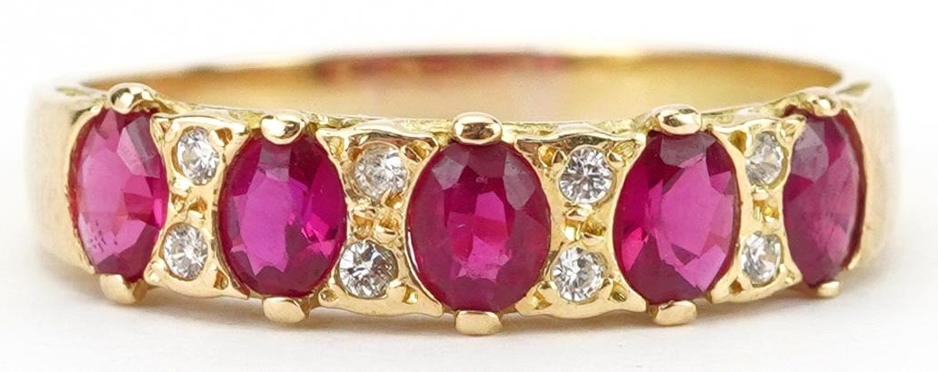 18K gold ruby and diamond half eternity ring set with five rubies and eight diamonds, each ruby
