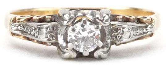 Unmarked gold diamond solitaire ring with ornate setting, total diamond weight approximately 0.15