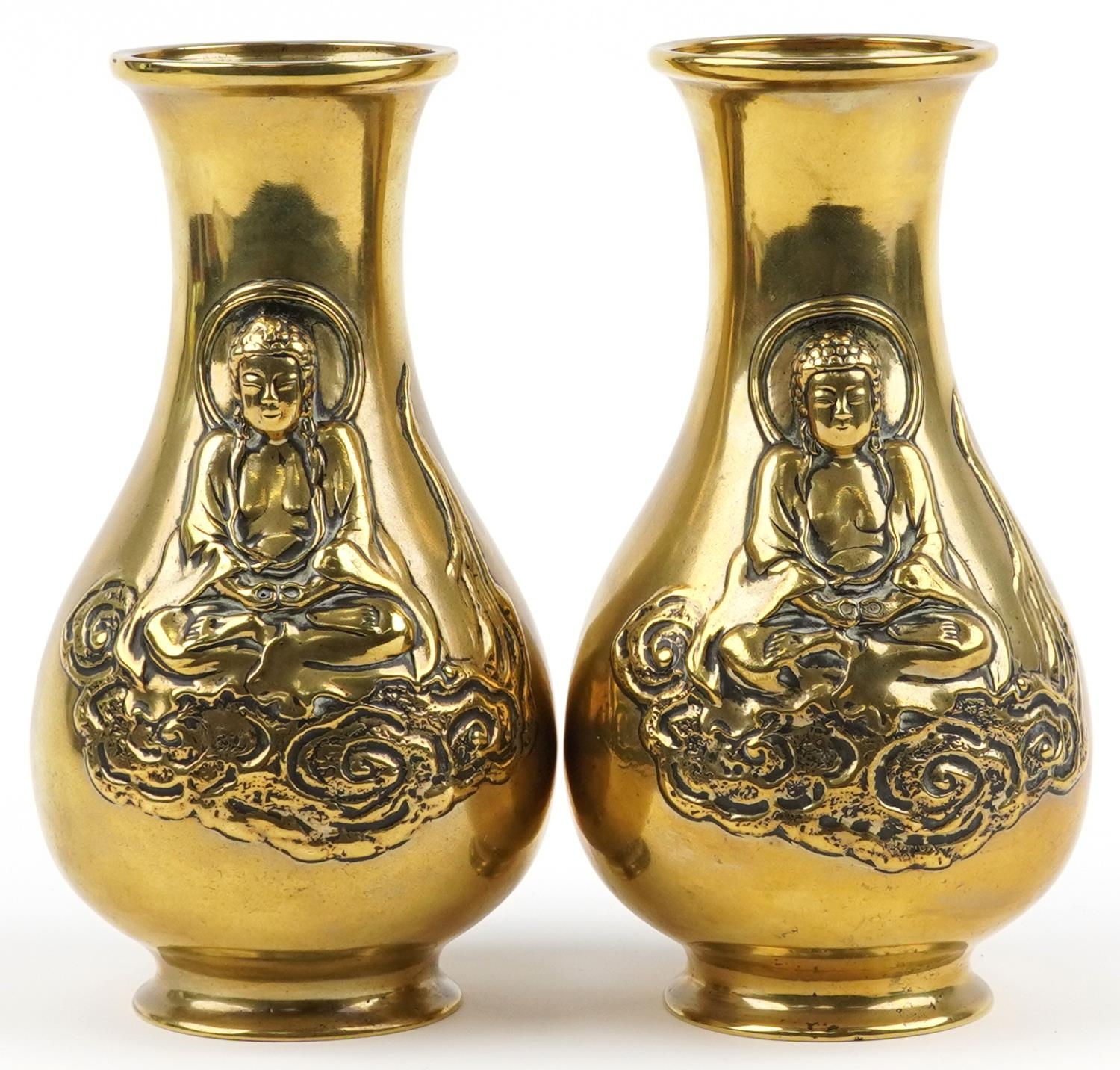 Pair of Chinese patinated bronze vases, each decorated in relief with Buddha, each 25.5cm high