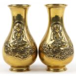 Pair of Chinese patinated bronze vases, each decorated in relief with Buddha, each 25.5cm high