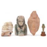 Four Egyptian artefacts including a blue faienced shabti bust and a carving of Achnaton, two