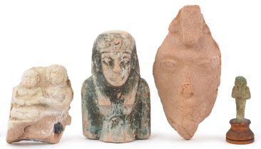 Four Egyptian artefacts including a blue faienced shabti bust and a carving of Achnaton, two