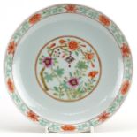Chinese porcelain shallow dish hand painted in the famille rose palette with flowers, six figure