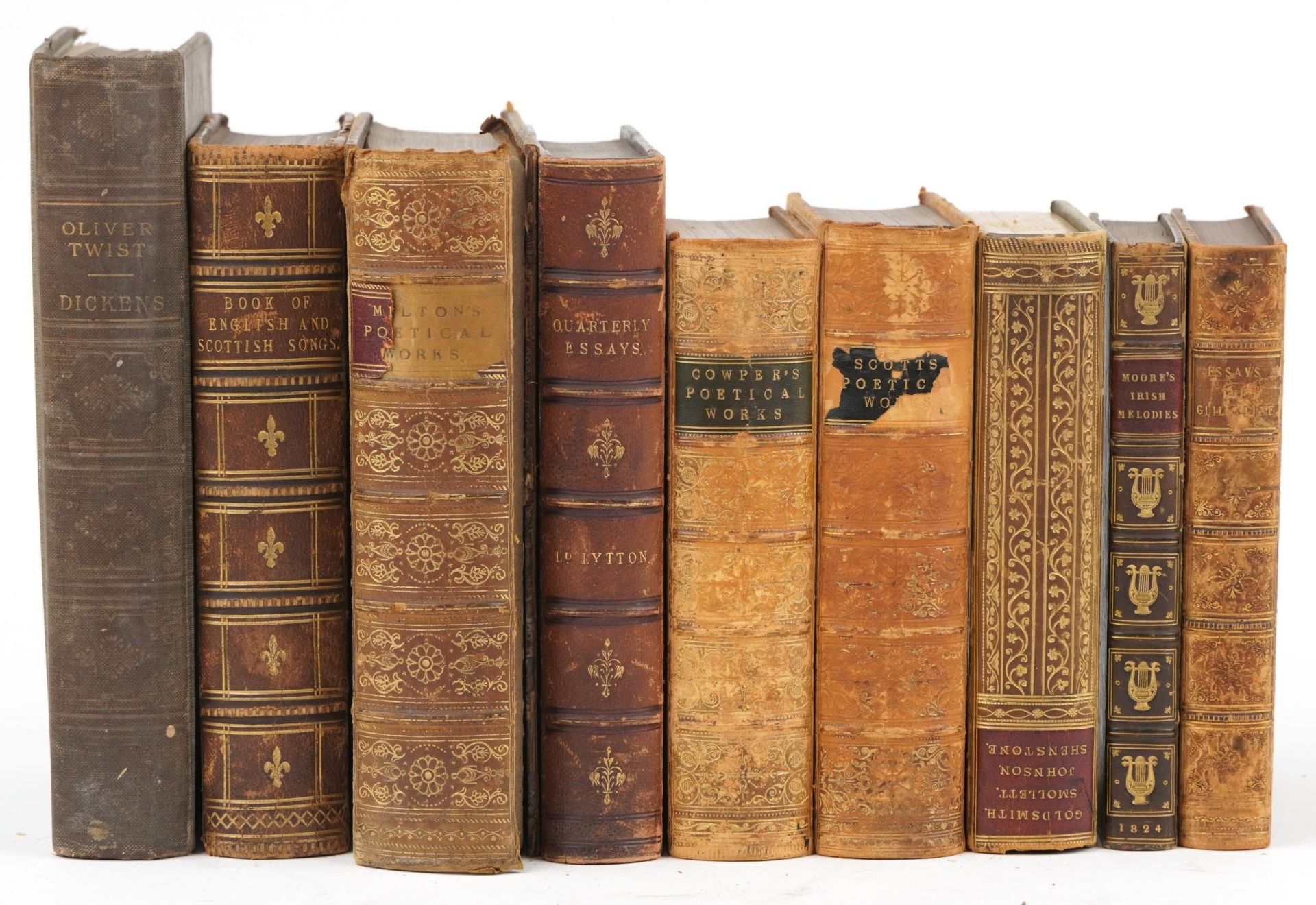 Nine 19th century hardback books comprising Oliver Twist by Charles Dickens, Quarterly Essays,