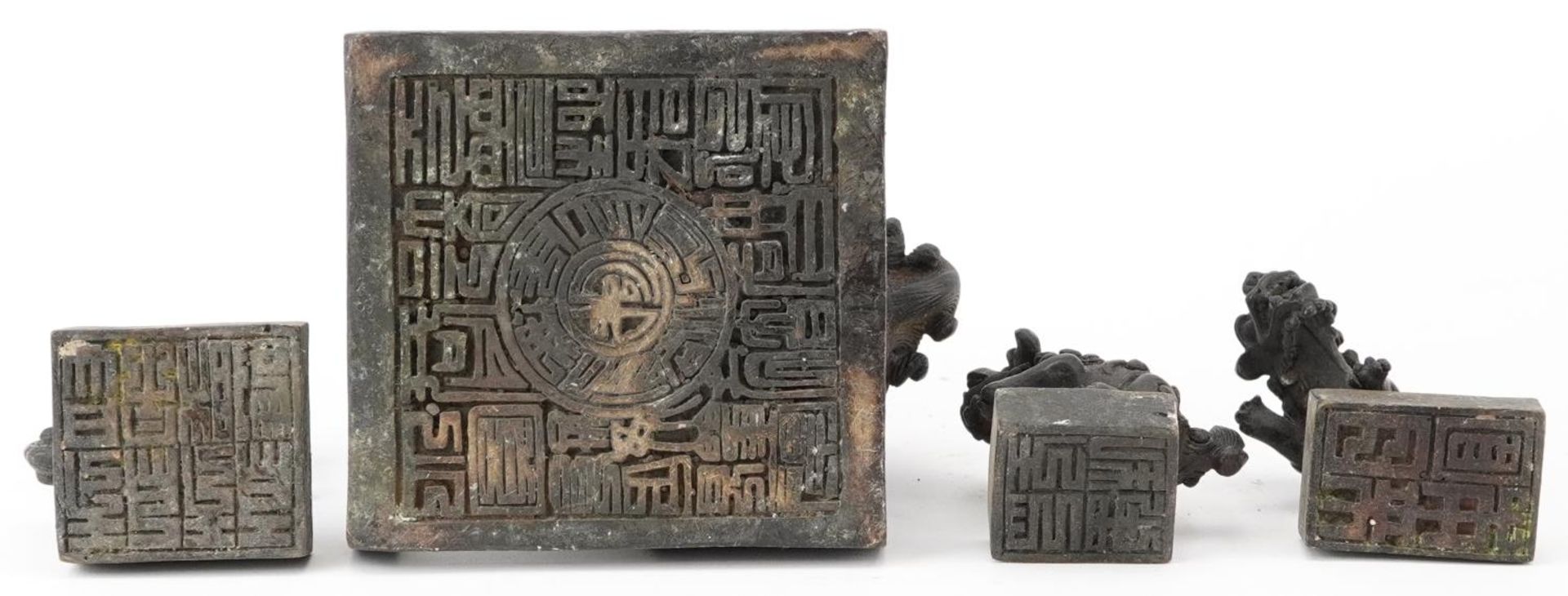 Set of four Chinese patinated bronze interlocking desk seals in the form of qilins, 12cm high - Image 8 of 8