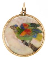 Unmarked gold mother of pearl collage locket decorated in feathers with two birds, 3.2cm in