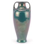 F T Lukas of Utrecht, Dutch Art Nouveau vase with twin handles having an iridescent blue glaze,
