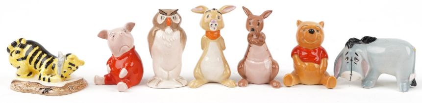 Seven Beswick and Royal Doulton Disney Winne the Pooh characters including Winnie the Pooh, Tigger