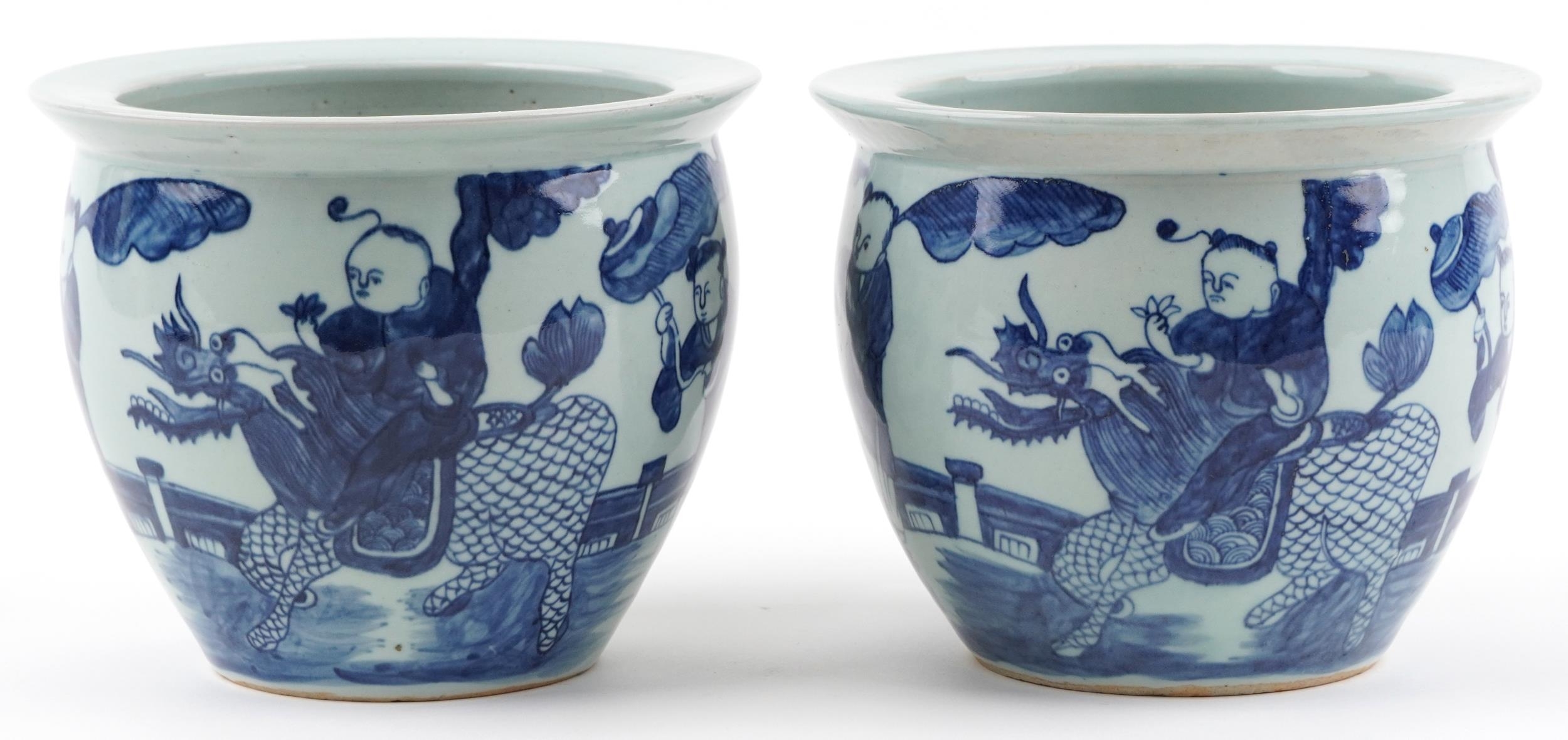 Pair of Chinese blue and white porcelain jardinieres painted with children playing in a palace