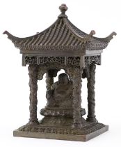 Chinese patinated bronze study of Buddha seated in a pagoda, 15cm high