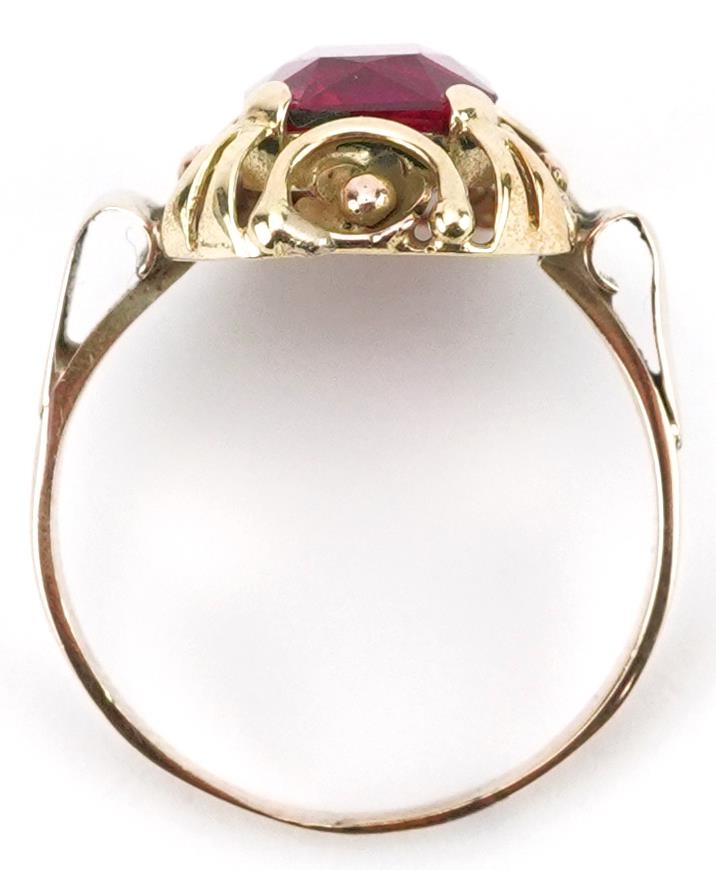 Continental unmarked gold ruby ring with pierced flower head setting, tests as 15ct gold, the ruby - Image 3 of 3