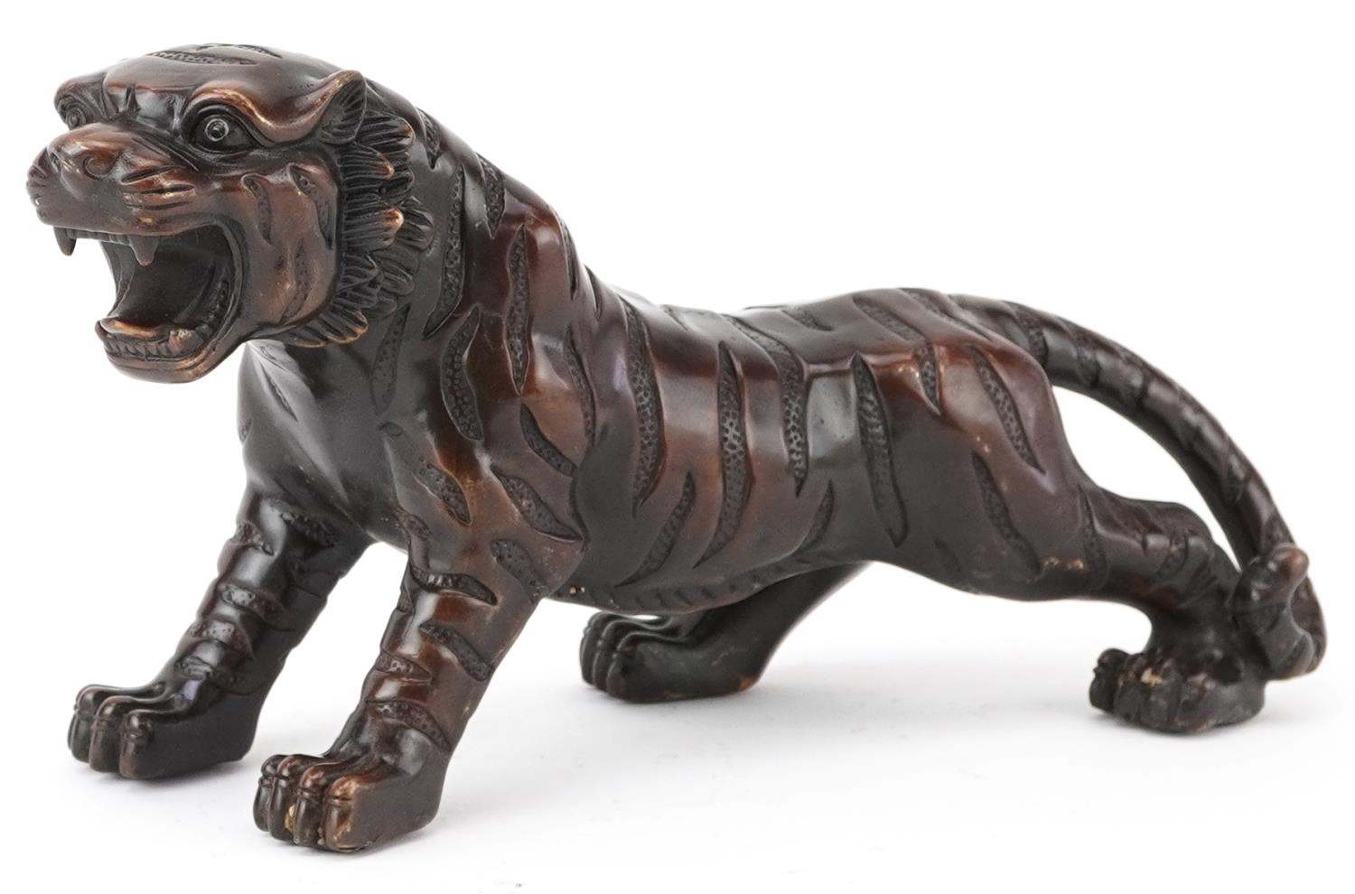 Japanese patinated bronze okimono of a tiger, 35cm in length