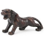 Japanese patinated bronze okimono of a tiger, 35cm in length