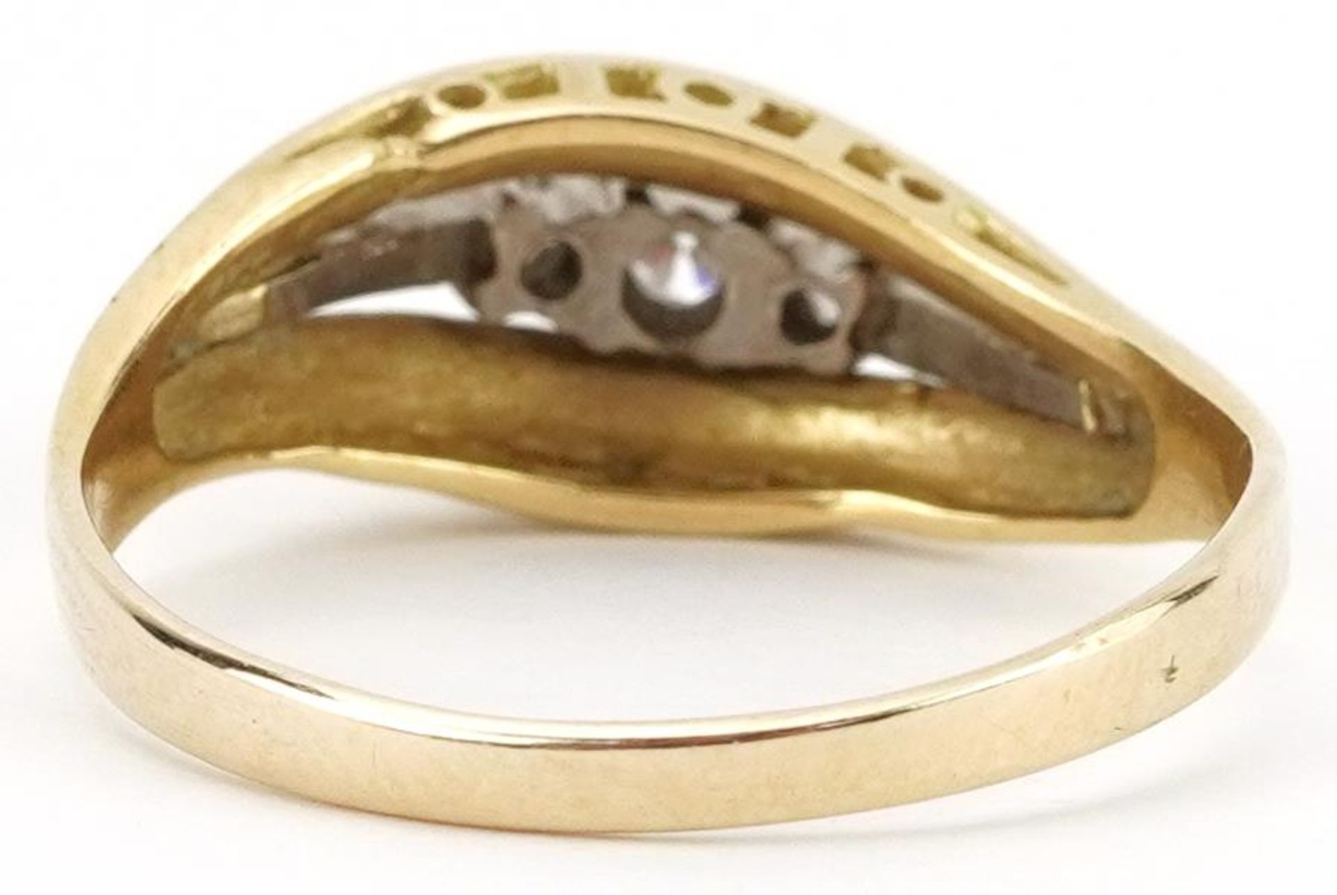 Two tone gold diamond three stone ring, indistinct mark to the band, the central diamond - Image 2 of 4